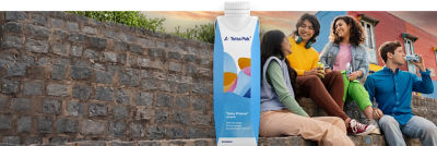 Young people with Tetra Prisma Aseptic carton packages, on-the-go consumption