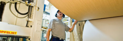 Man next to packaging machine