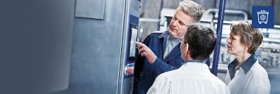 Service engineer and customers, display on filling machine, waste bin icon