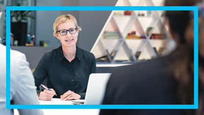 woman with glasses and blue frame border