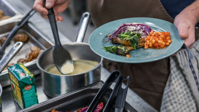 Saucepan and plate with food and Tetra Recart package