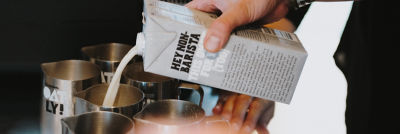 Pouring oat milk into glass