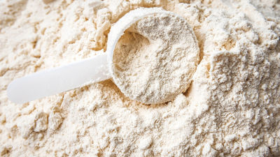 Powder ingredient processing showing fine food powder texture and handling