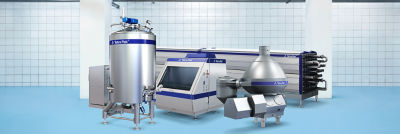 Industrial processing facility with multiple stainless steel machines in a clean equipment room