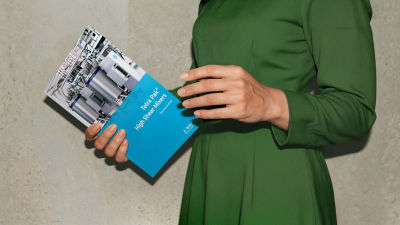 Person holding high shear mixer brochure