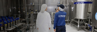 Employees walking through industrial processing facility