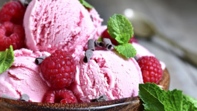 Ice cream and raspberries in a bowl