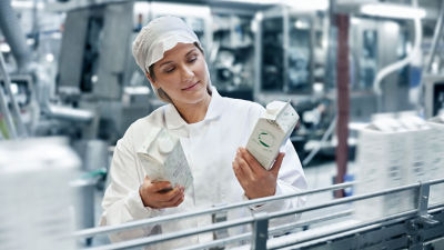 Packaging expert reviewing Tetra Rex carton packages