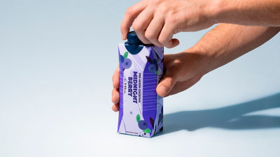 RTD alcoholic beverage in carton in hands