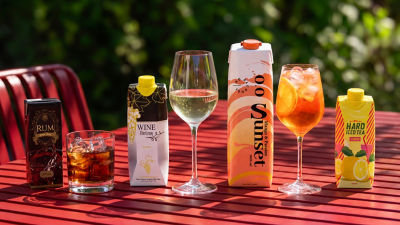 Spirits, wine, and RTD alcoholic beverages in carton on a table