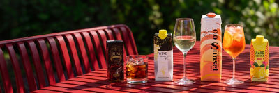 Spirits, wine, and RTD alcoholic beverages in carton on a table