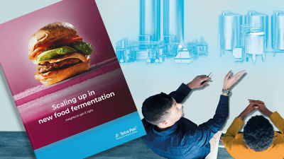 Brochure and two people standing on the side