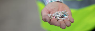 Shredded beverage carton in hand