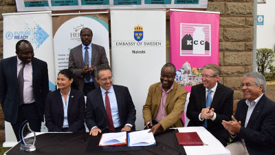 men signing agreement