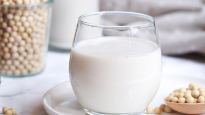 Soya milk in glass and soya beands