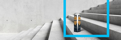 Coffee in Tetra Top carton standing on the stairs, blue frame