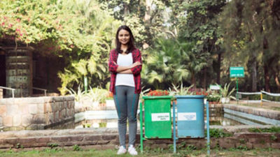 Girl and waste bins