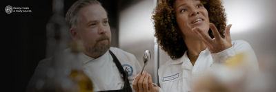 Chef and customer testing food at the Food development centre