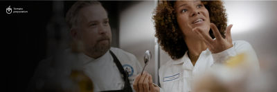 Chef and customer testing food at the Food development centre