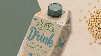 Craft package on green brown cardboard with soybeans