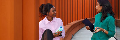 Two women speaking to each other