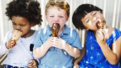 Three children eating ice cream