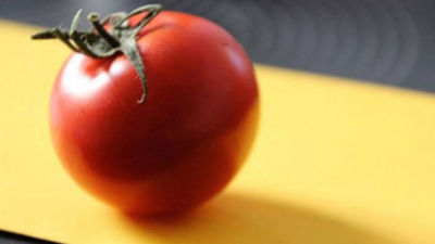 Tomato on yellow board