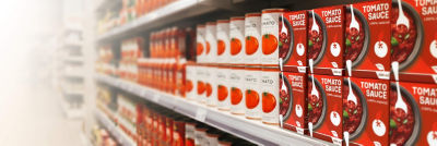 Cans and Tetra Recart cartons with tomato products on shelf
