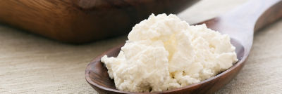 crumbled cheese in spoon