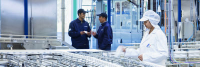 woman working with tetra pak machines