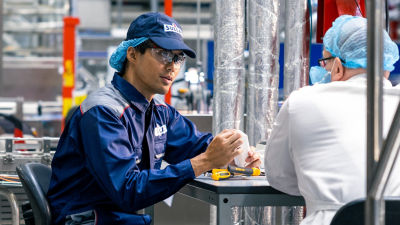 two men are working together