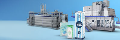 Tetra Brik Aseptic cartons, heat exchanger and filling machine in background