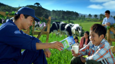 Vinamilk, man and boy drinking milk