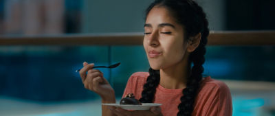 girl eating cake on plate