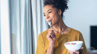 Woman eating yoghurt