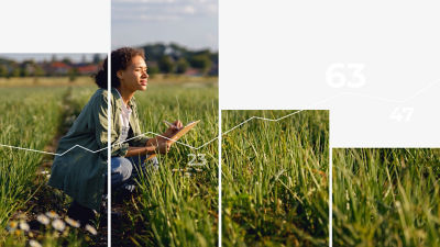 Woman in field with notepad