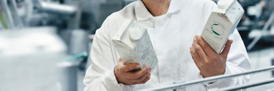 Man inspecting two cartons