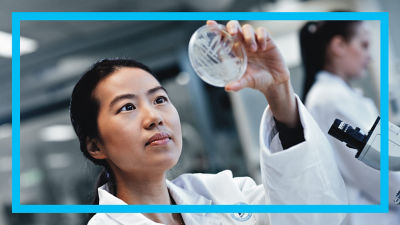 Woman looking at lab sample