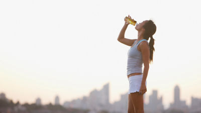 Woman drinking after exercise