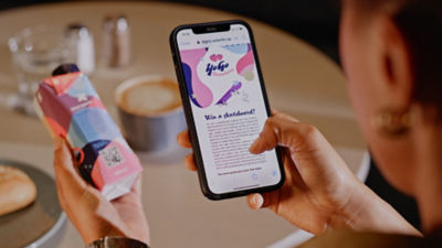 Scanning QR code on carton package, connected packages solutions