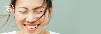 Woman smiling closed eyes green background white packaging distribution icon