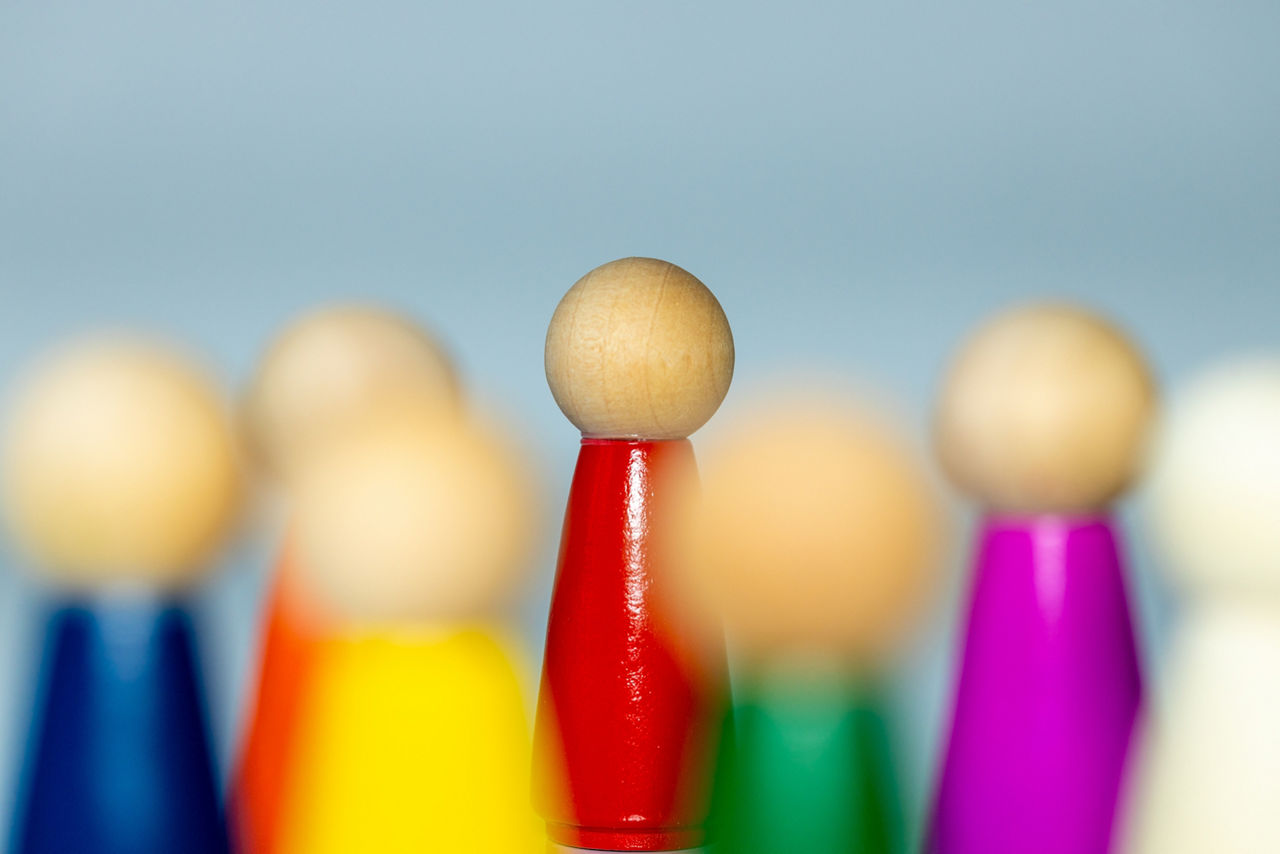 Colorful symbols of people, icon of a multicultural team, Meeting in a company, social diversity, cooperation between people, evaluation of team work by a leader