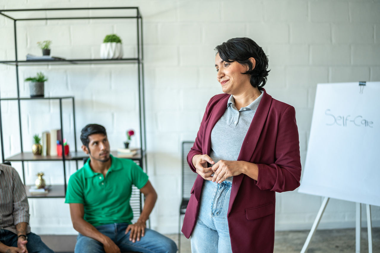 Mid adult woman doing a presentation during meeting
