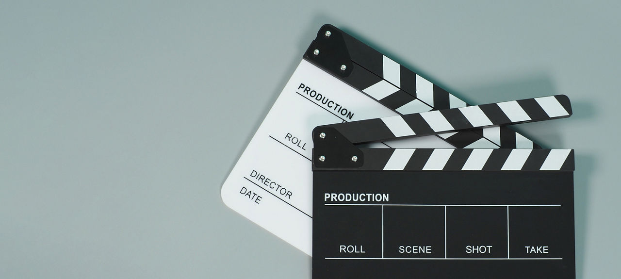 Black and white Clapperboard or clapper board or movie slate use in video production ,film, cinema industry on gray background