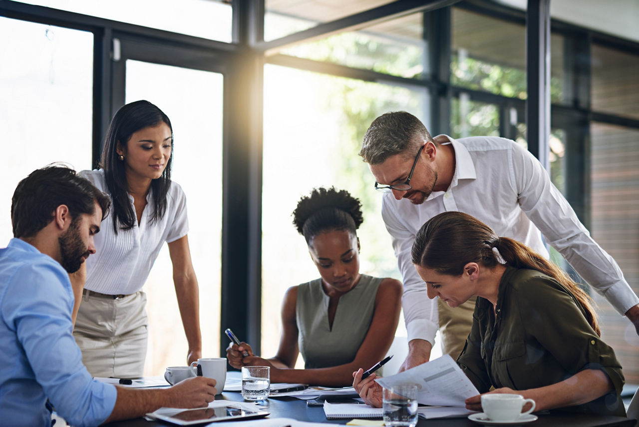 Business people, meeting and budget planning in boardroom for audit and financial logistics with paperwork. Corporate group, teamwork and company review for discussion about spending and resources