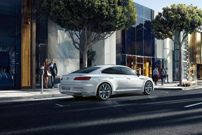 Arteon Elegance parking on street in front of white building