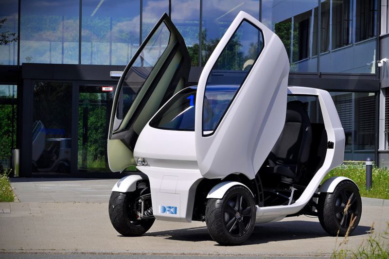 The “EO smart connecting car” electric vehicle has wing doors