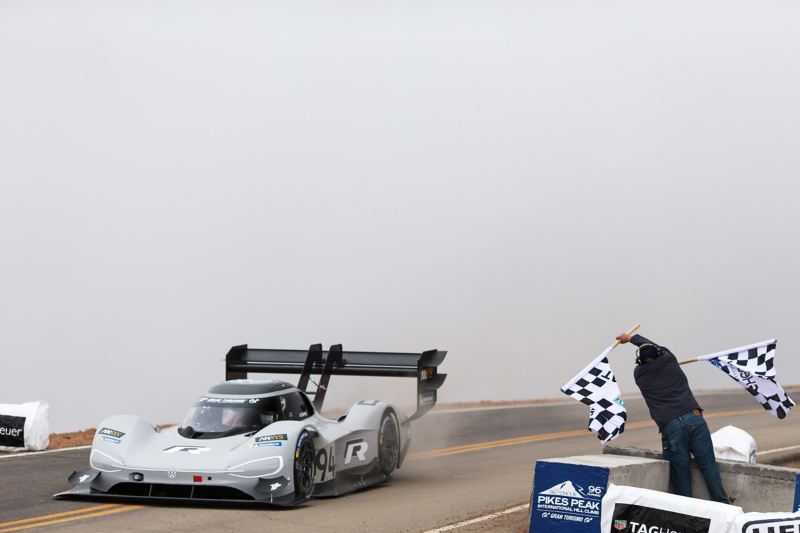 An E racing car crosses the finish line at Pikes Peak