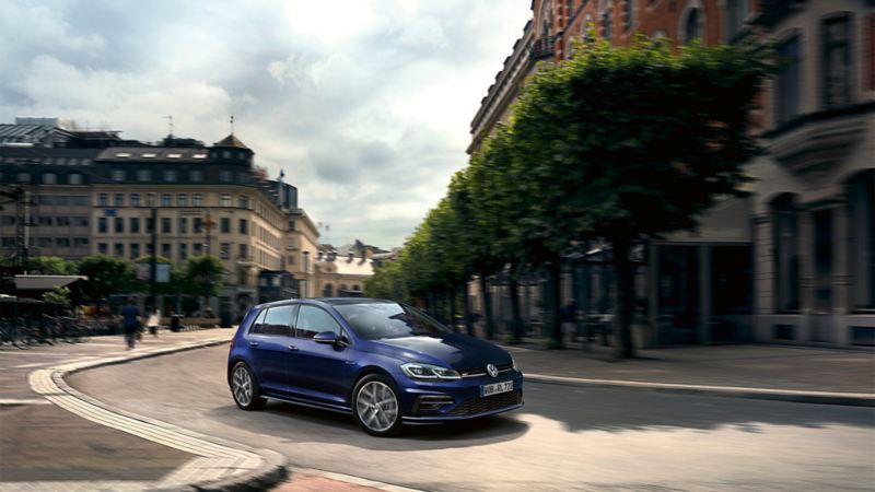 VW Golf driving on a street