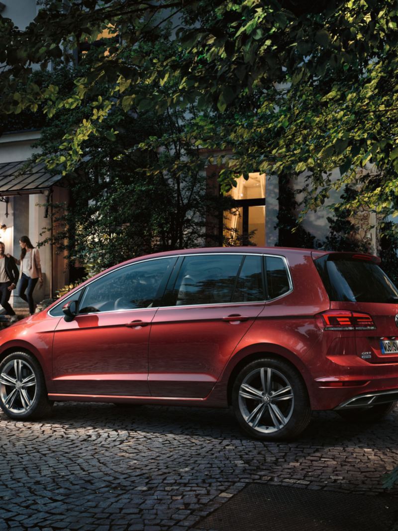 VW Golf Sportsvan parking in front of house